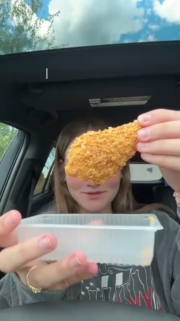 Allie holds up the drumstick